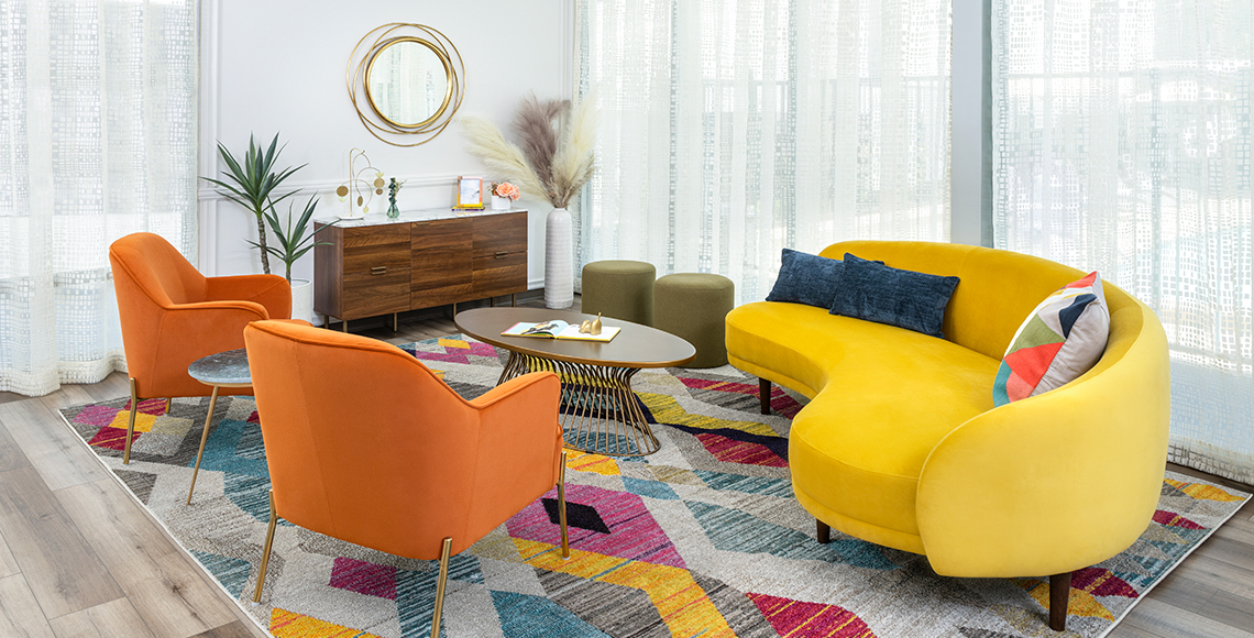 lounge area with orange chairs and yellow couch