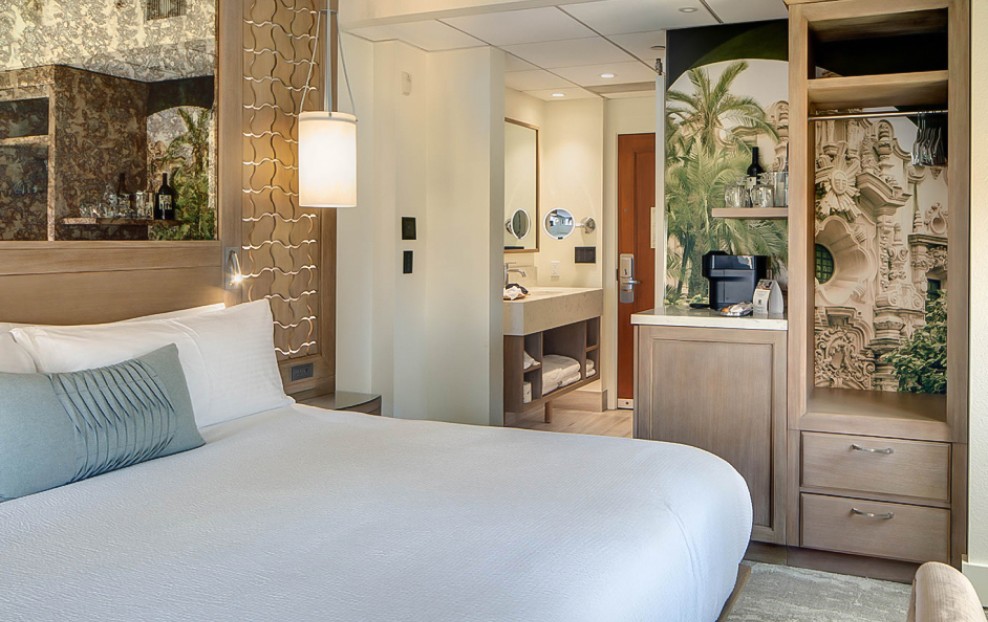 a room with a bed and a shelf