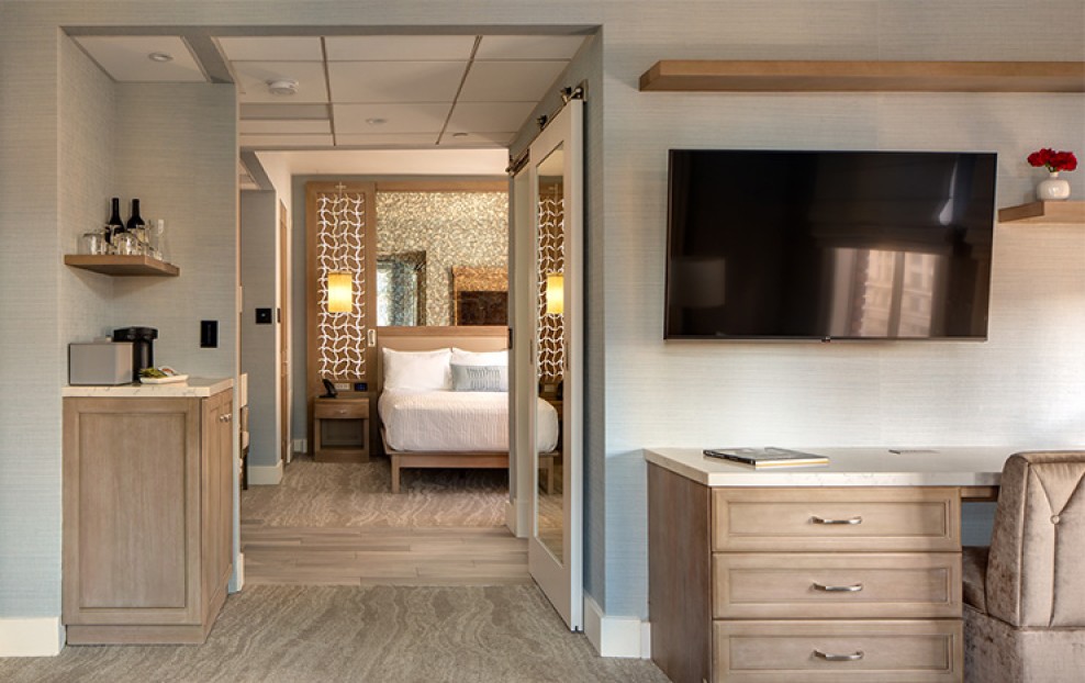 a bedroom with a television and a bed