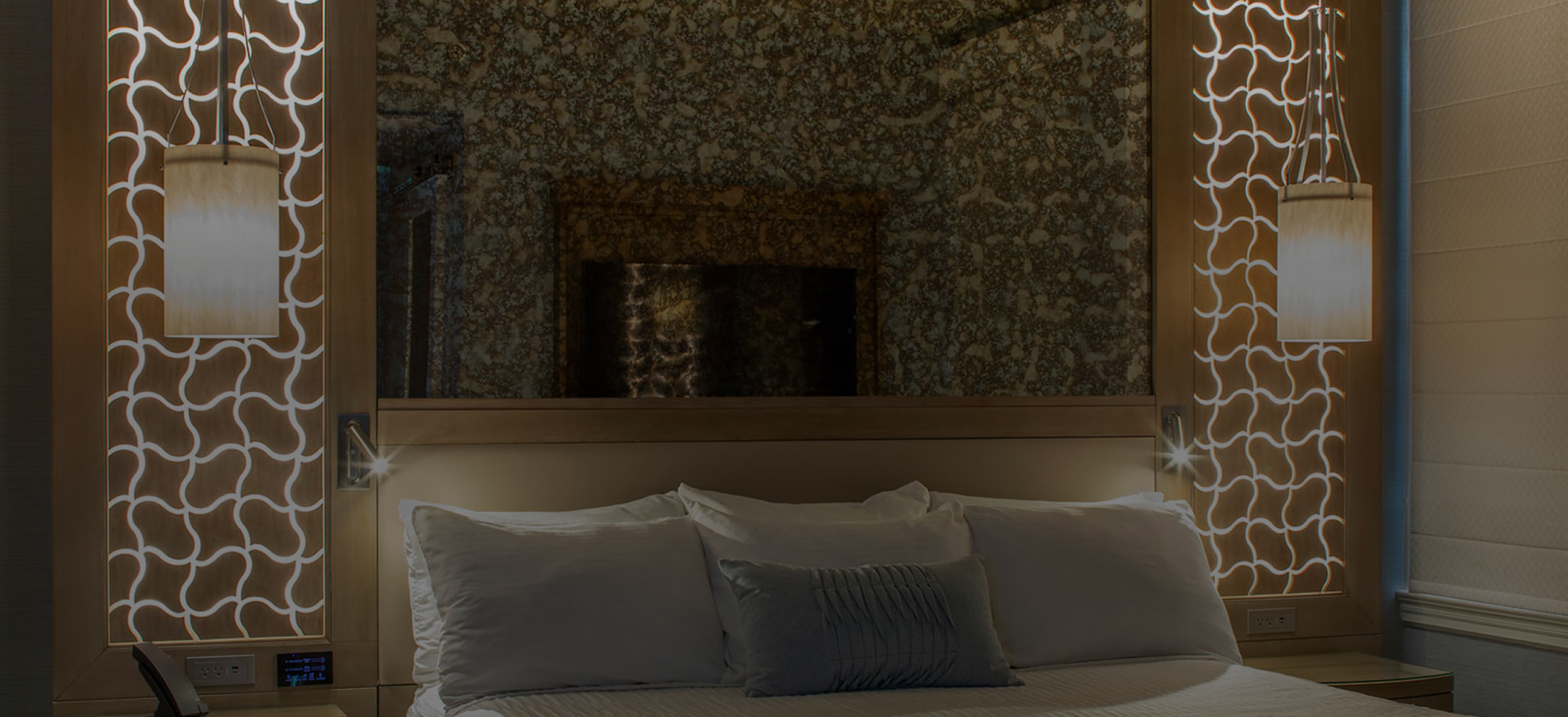 a mirror above a bed