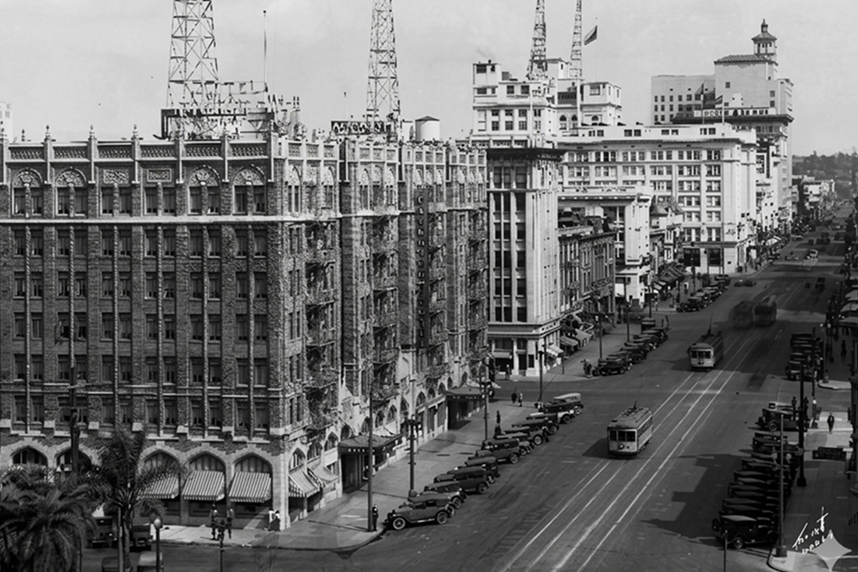 a street with cars and buildings