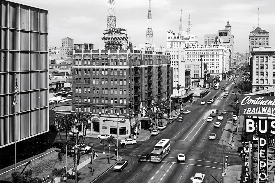 a city street with cars and buildings