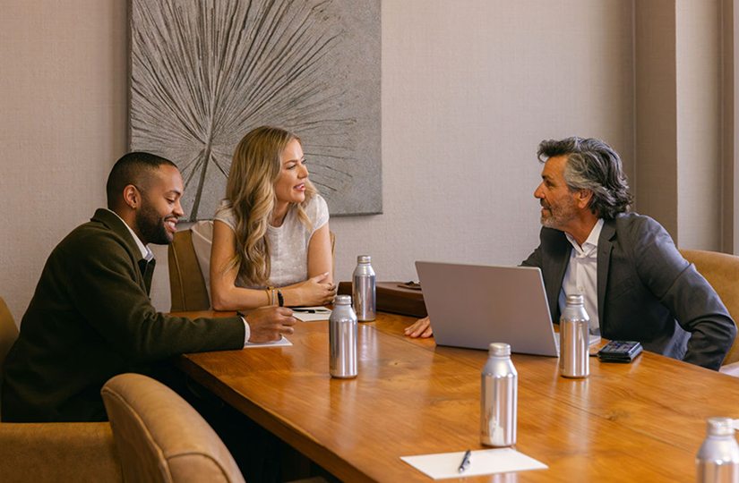 a group of people sitting at a table
