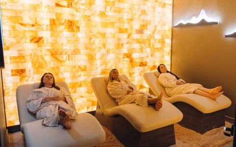 a group of women lying in chairs in a room