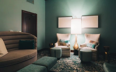 a room with a couch and a lamp