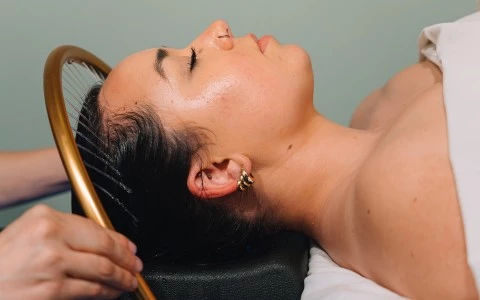 a woman getting a hair treatment