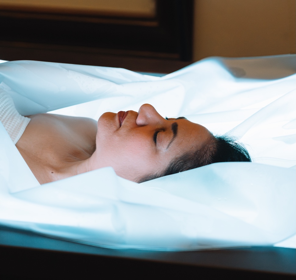 a woman lying in a bed