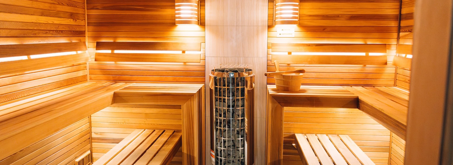 a sauna with a bucket and a bucket
