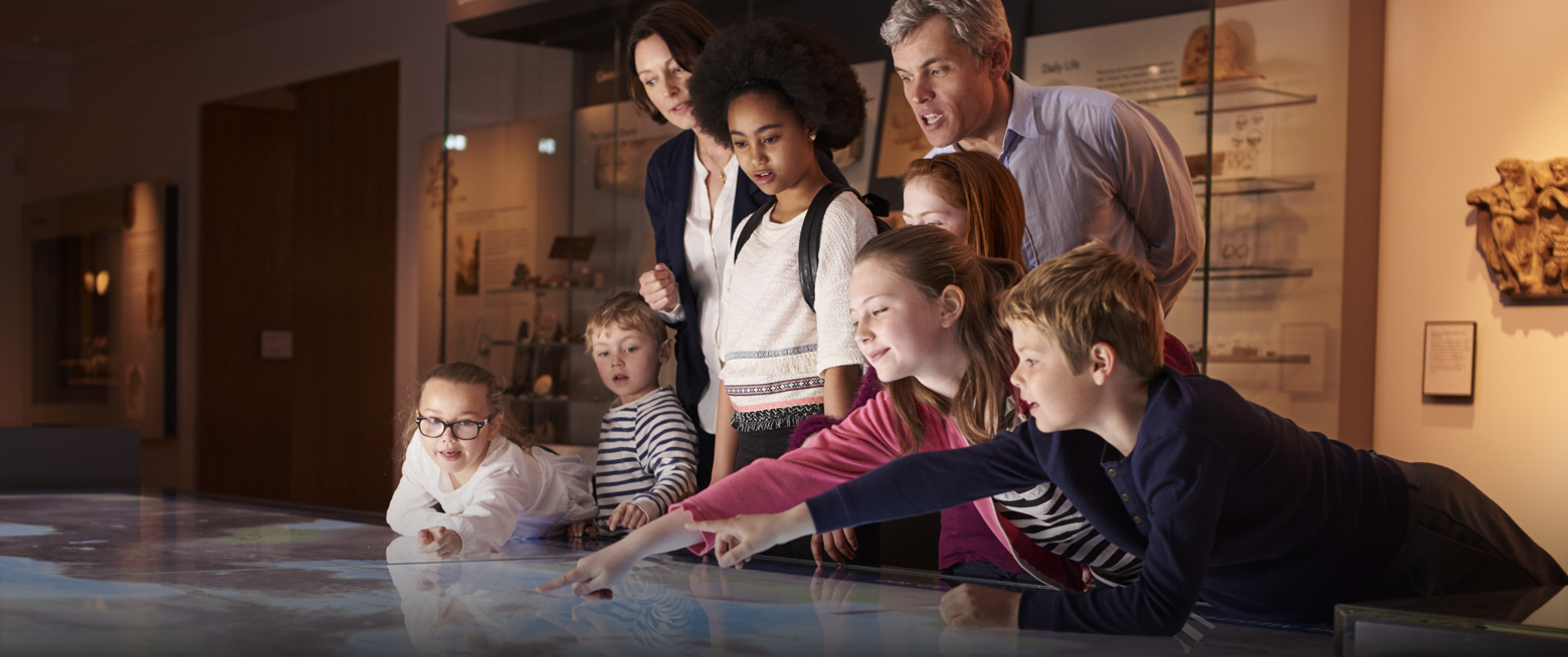 a group of people looking at a map