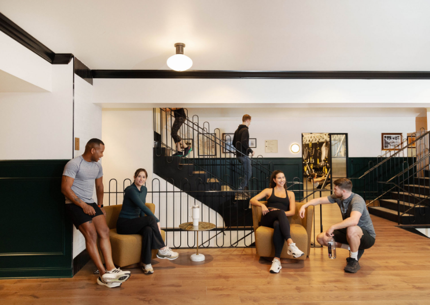 a group of people sitting in chairs in a room