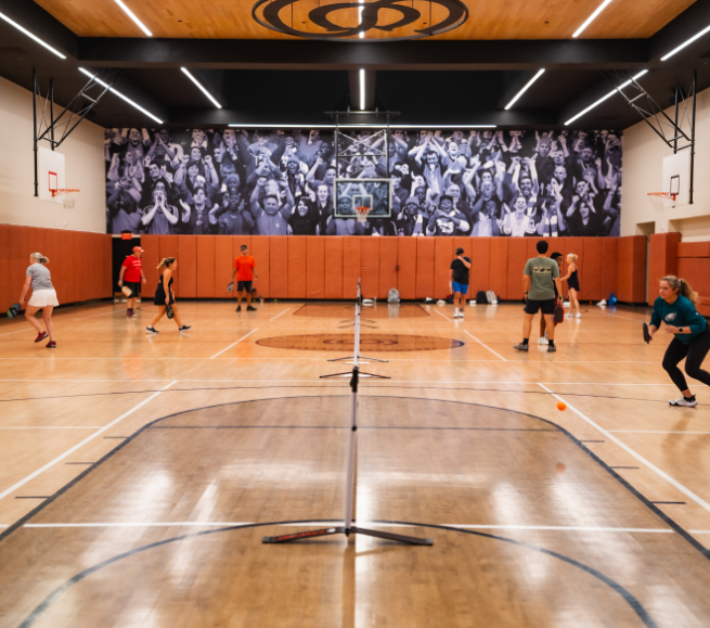 a group of people in a gym