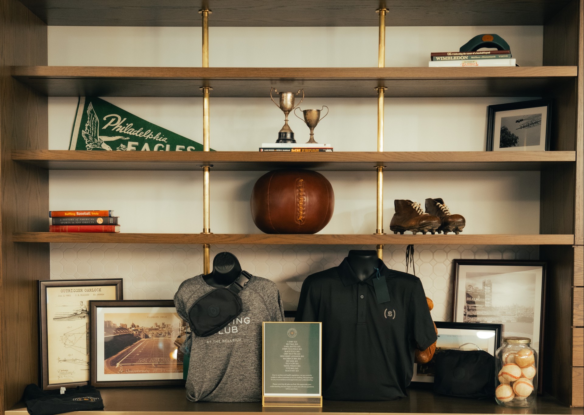 a shelf with a trophy and a display of sports items