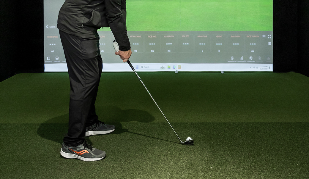 a person holding a golf club