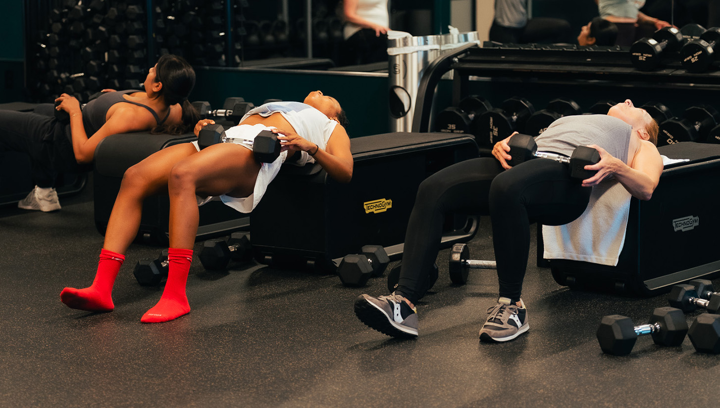 a group of people working out in a gym