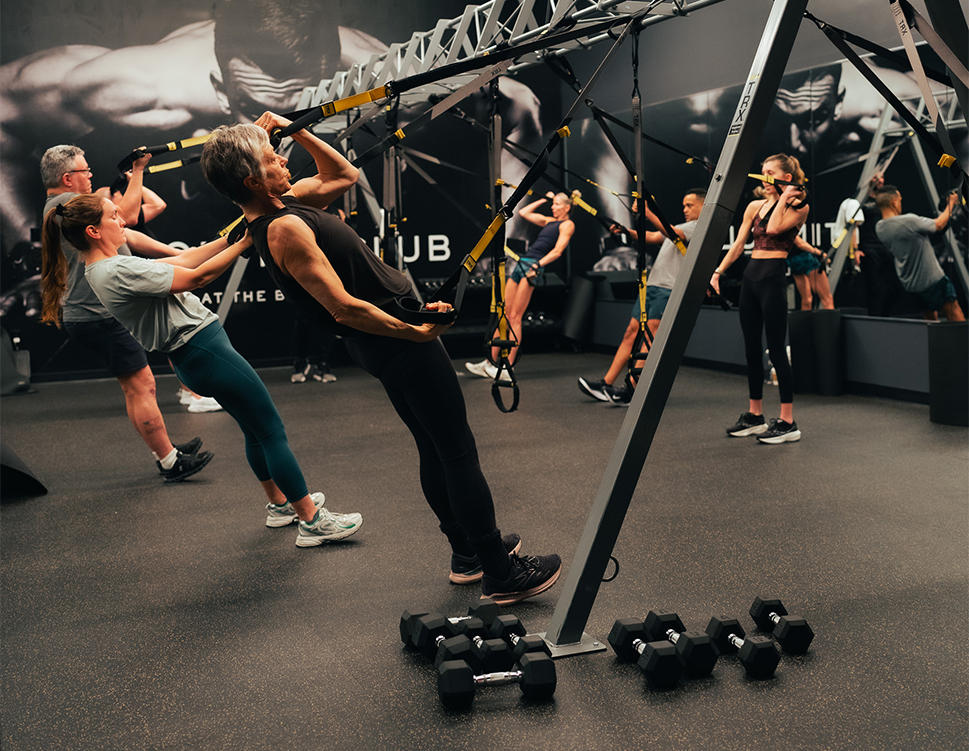 a group of people working out in a gym