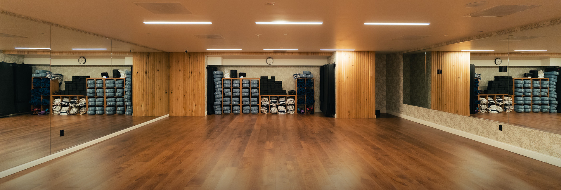 a room with a wood floor and a large room with a wood floor and a wood floor