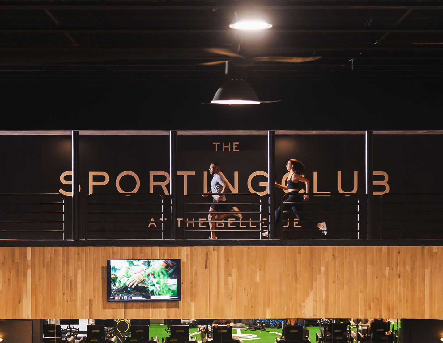 people running on a balcony