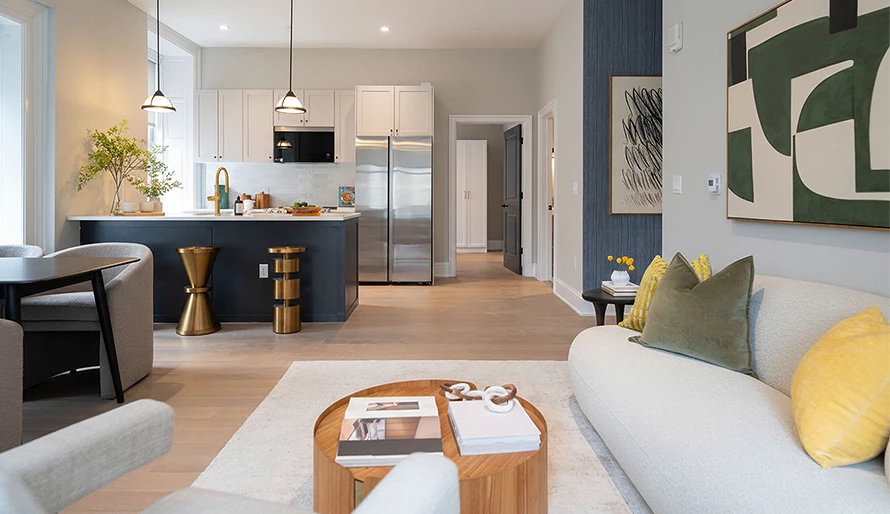 a living room with a kitchen and a couch