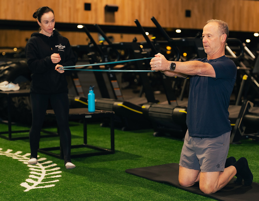a man and woman in a gym
