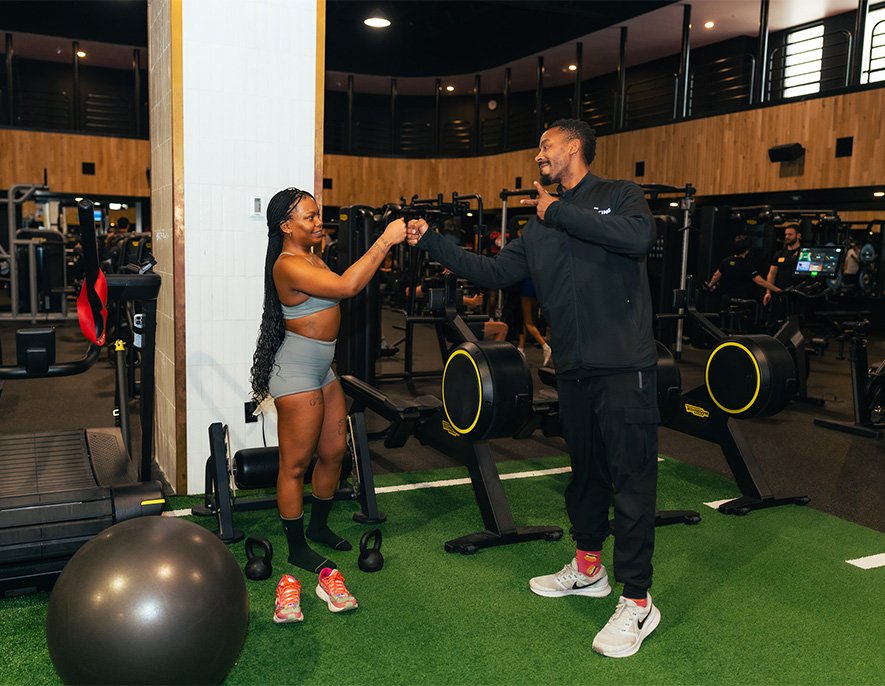 a man and woman in a gym
