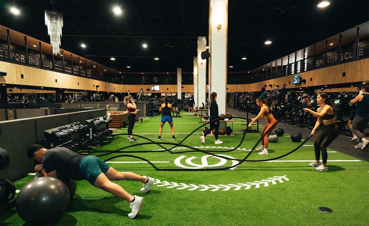 a group of people working out in a gym