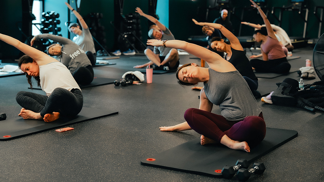 a group of people doing yoga