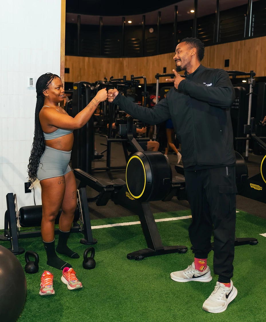 a man and woman in a gym
