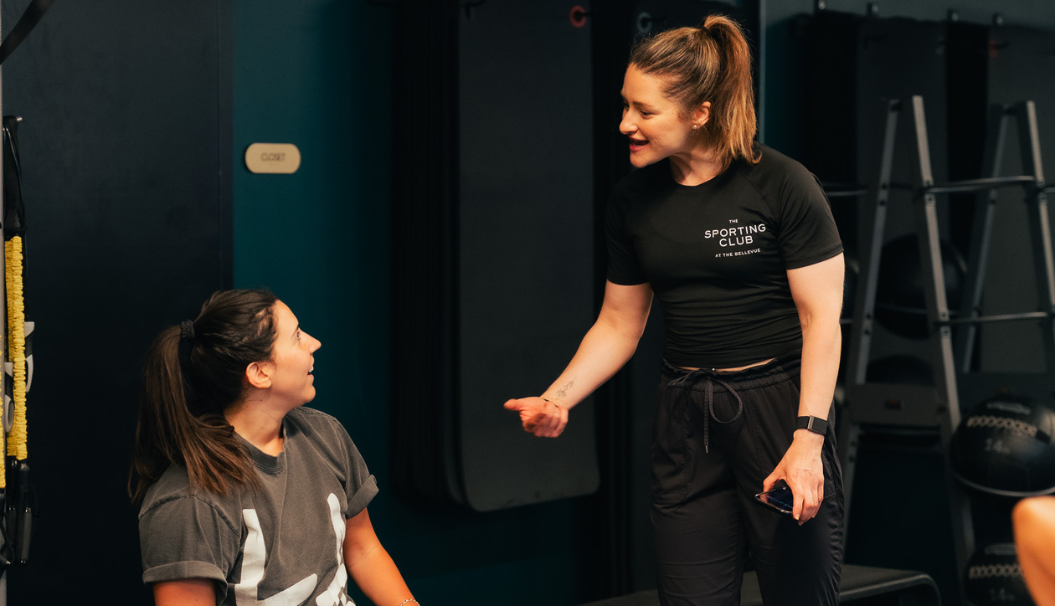 a woman talking to another woman