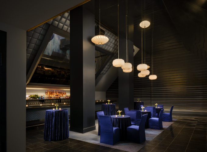 a room with blue tables and chairs