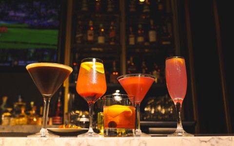 a group of drinks on a bar