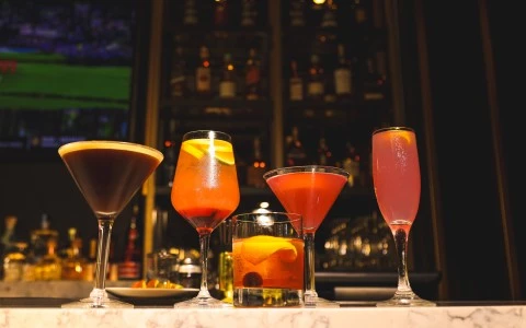 a group of drinks on a bar