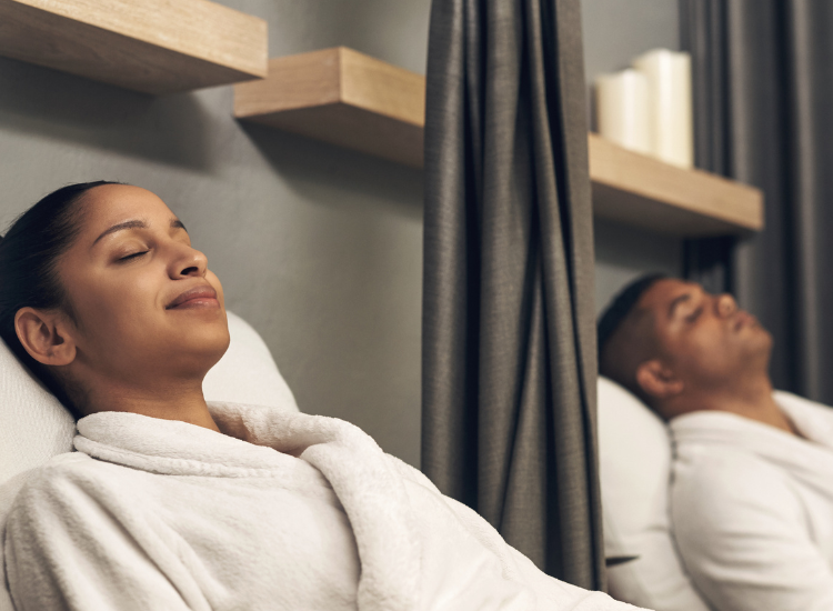 a woman and man sleeping in a room