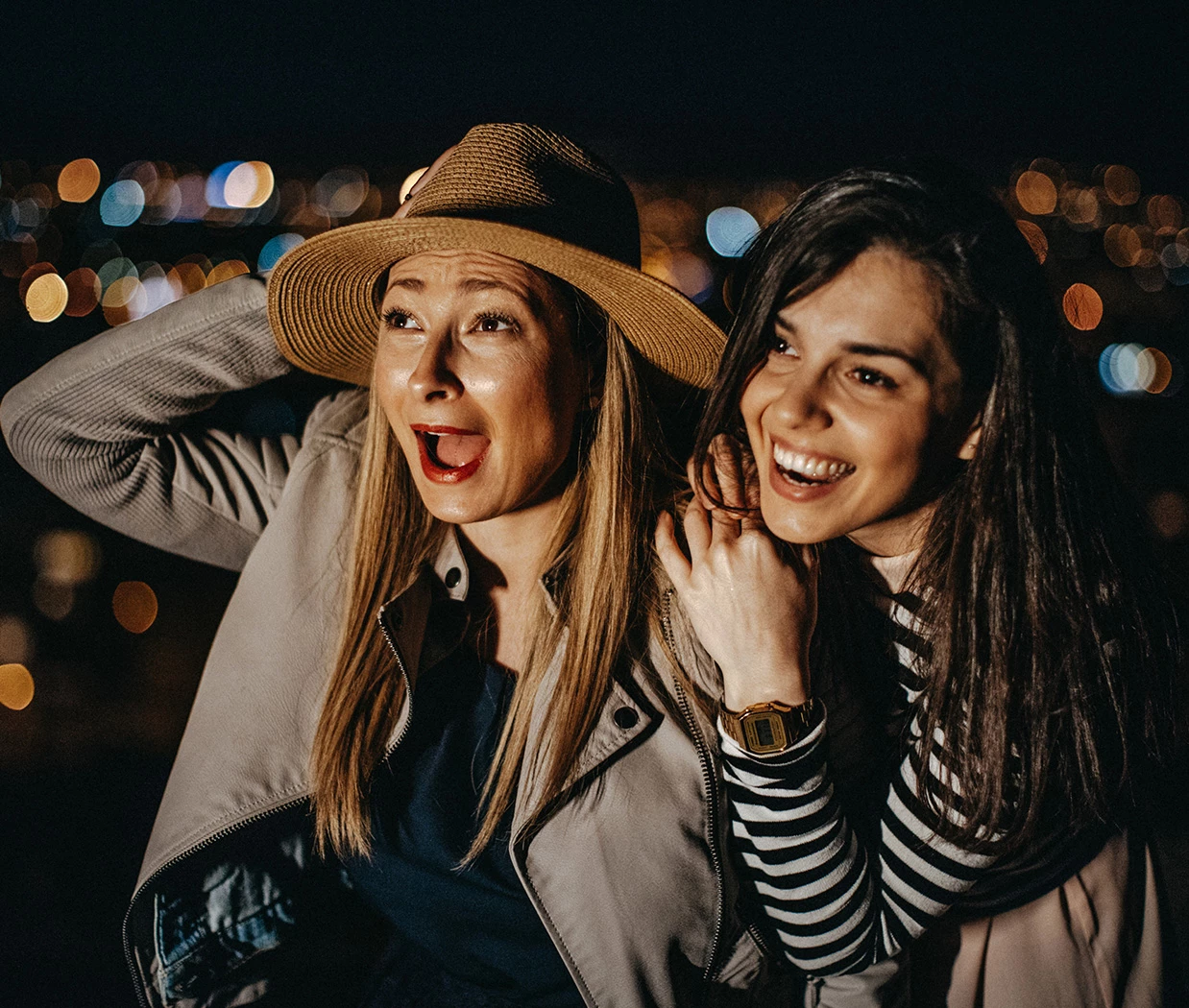 two women smiling at the camera