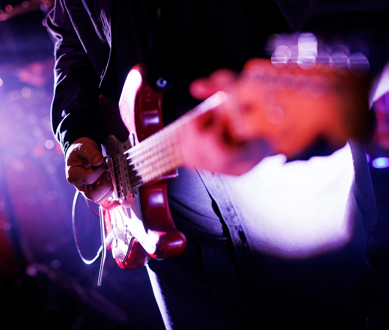 a person playing a guitar