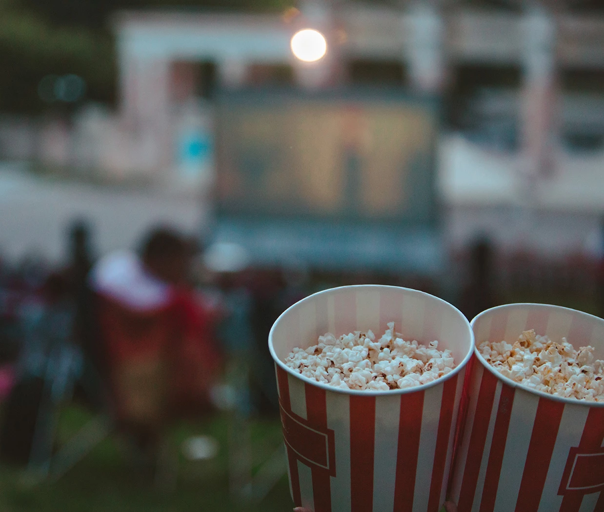 a pair of buckets of popcorn