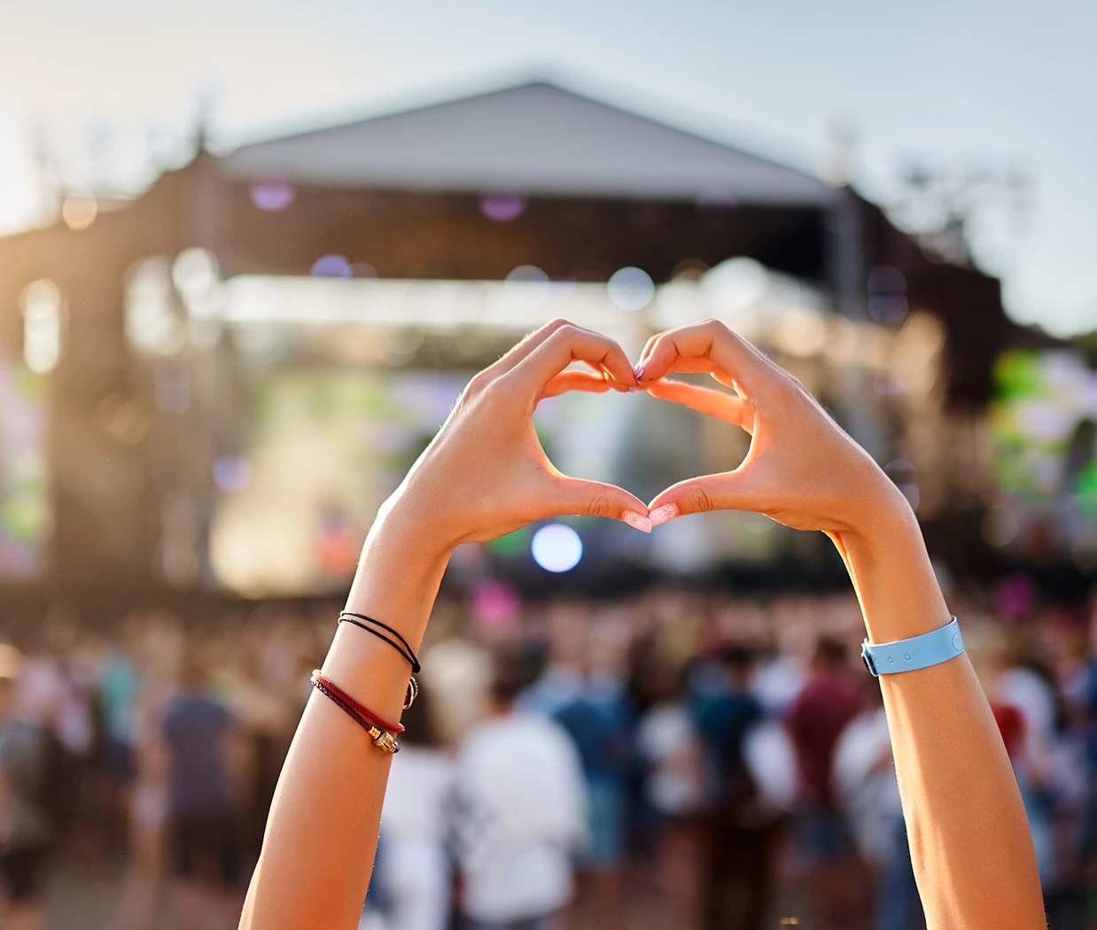 a person making a heart with their hands