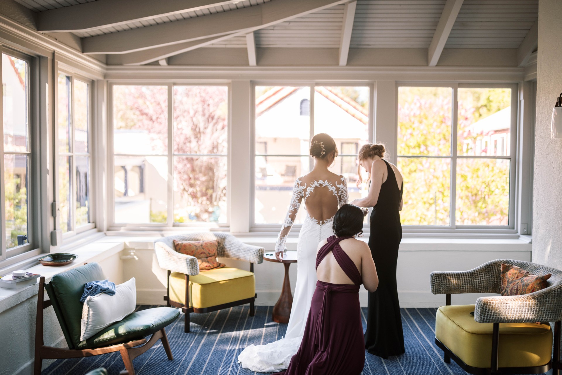 a group of women in formal dresses