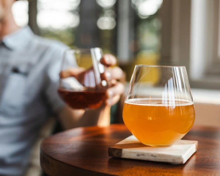 a glass of liquid on a table