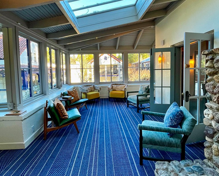 sun room with blue carpet floors