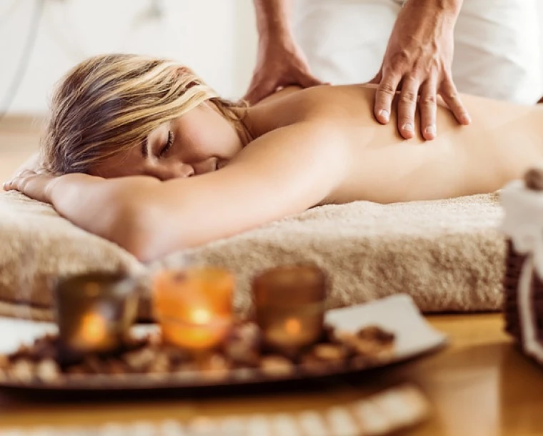 person getting a back massage spa treatment
