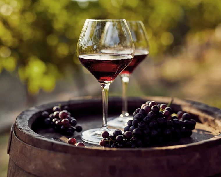 wine glasses and grapes on a tray