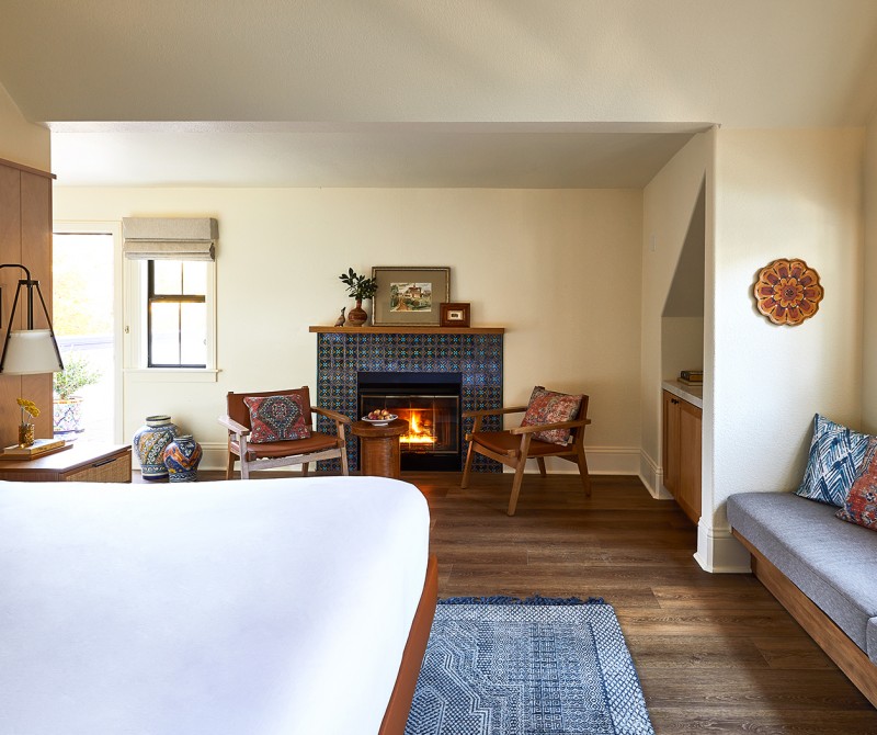 stavrand guest room with bed and fire place
