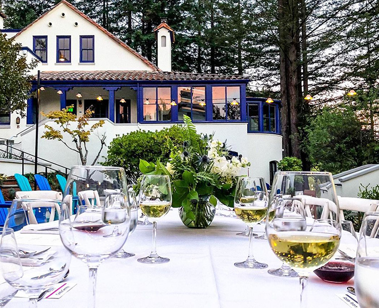 courtyard with table set up and wine glasses