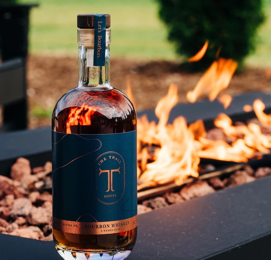 a bottle of alcohol next to a fire