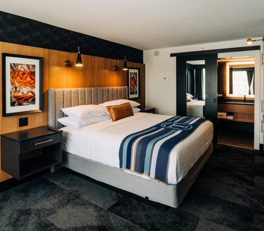 a bed with a bed headboard and a mirror