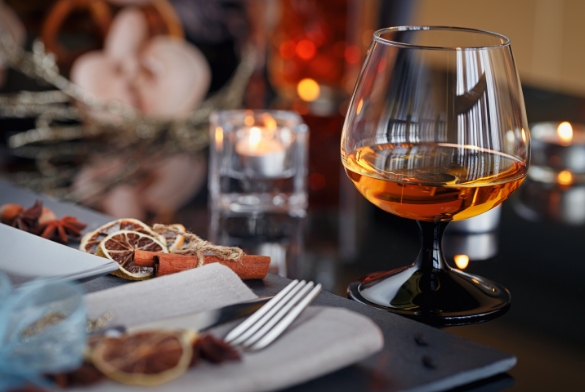a glass of alcohol on a table
