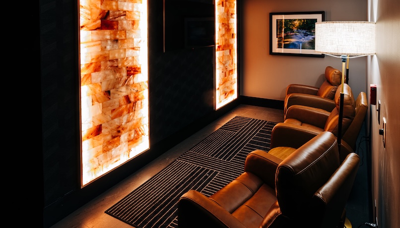 a room with leather chairs 