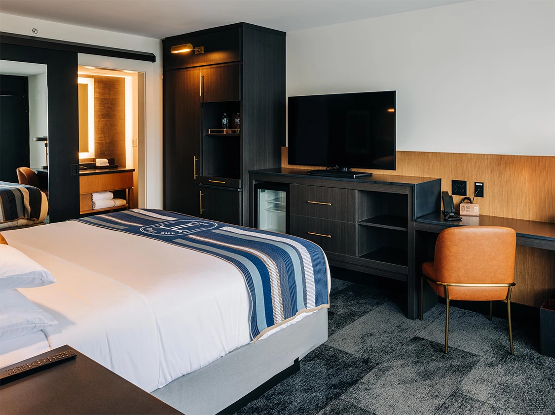 a room with a bed and a tv