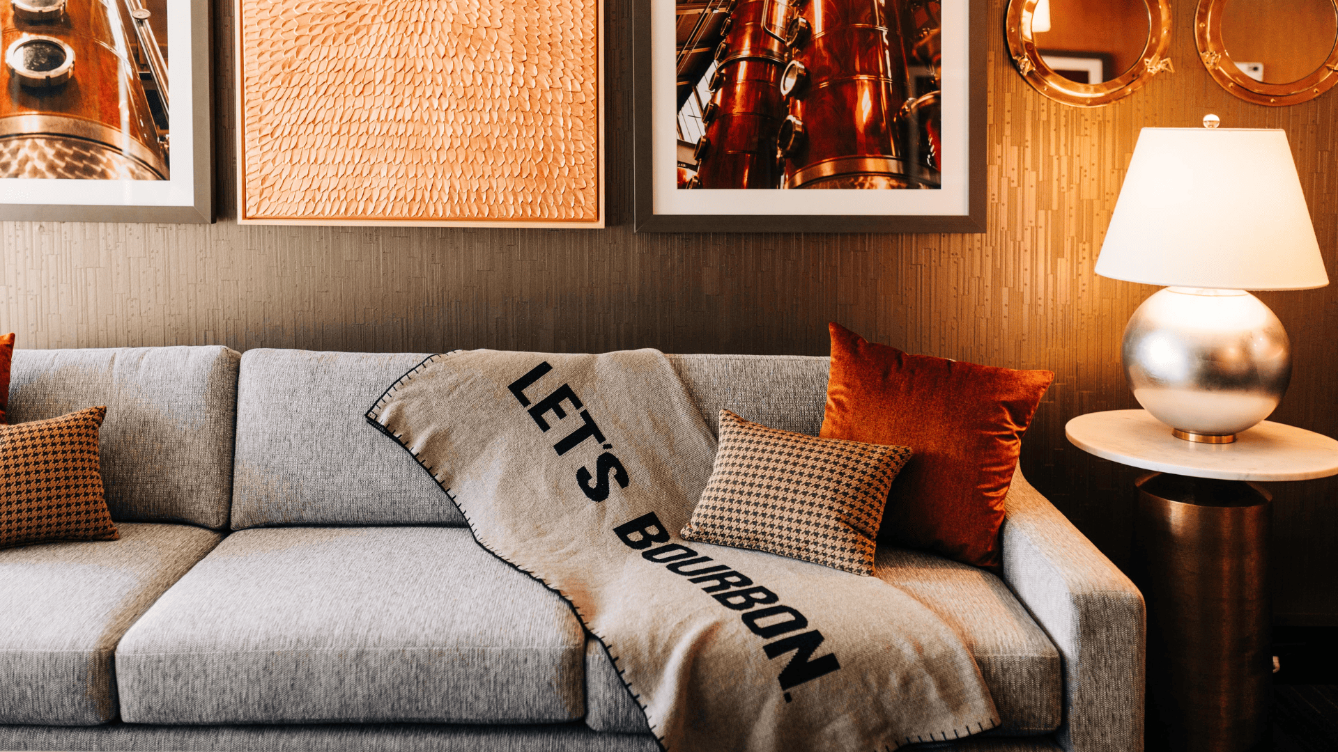 a couch with pillows and blanket on it