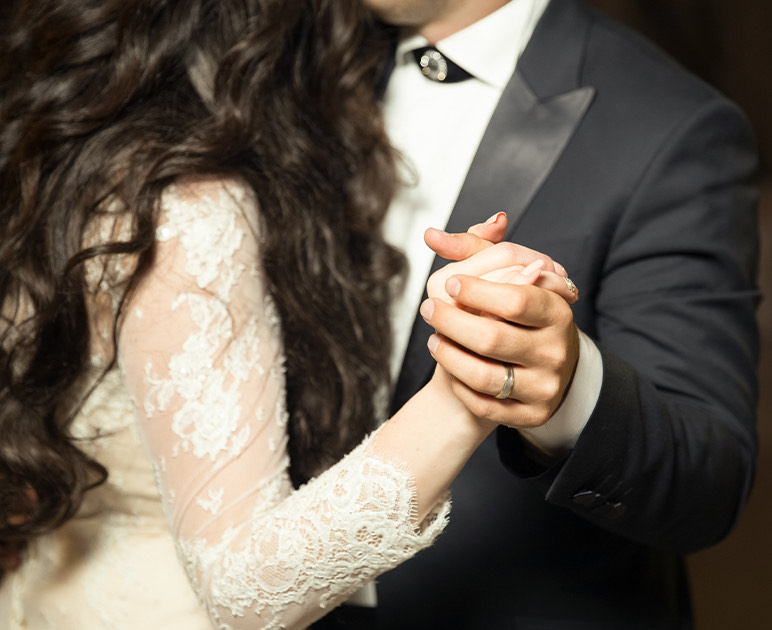 a man and woman holding hands